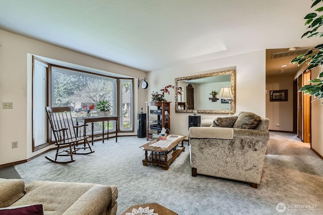 living area with baseboards and carpet floors