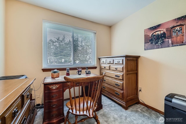 office with light colored carpet and baseboards