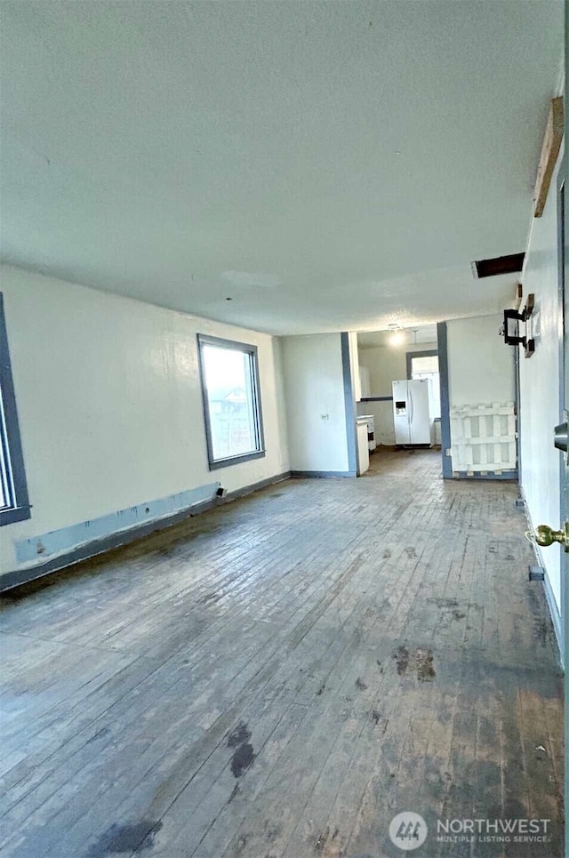 unfurnished living room featuring wood-type flooring