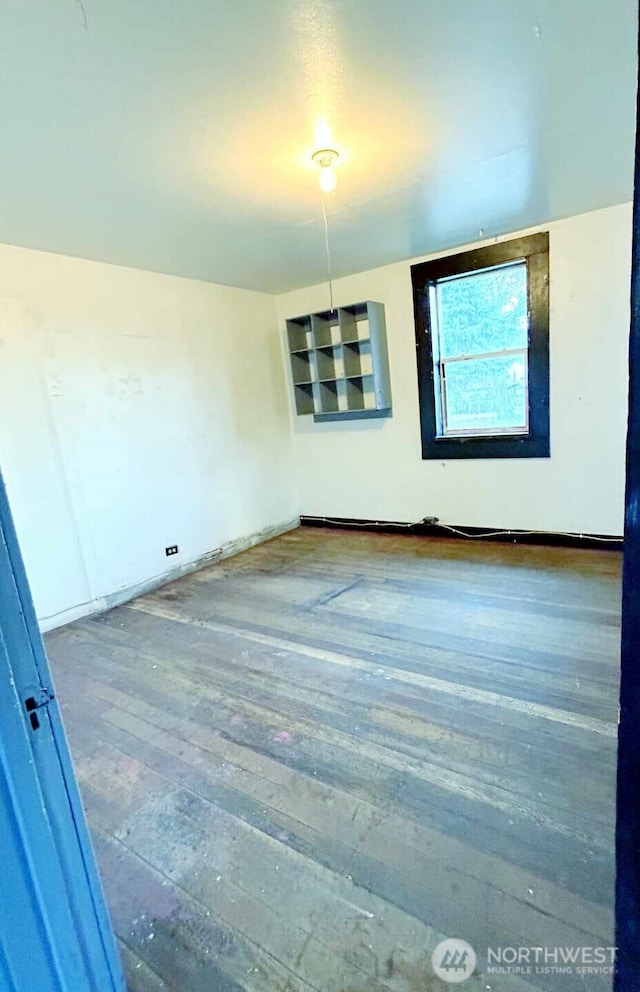 spare room with hardwood / wood-style flooring