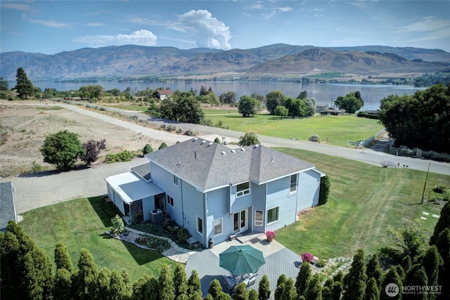 bird's eye view featuring a water and mountain view