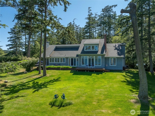 373 Eliza Rd, Lopez Island, WA 98261 - shingle-style home featuring a chimney, a front yard, and a deck