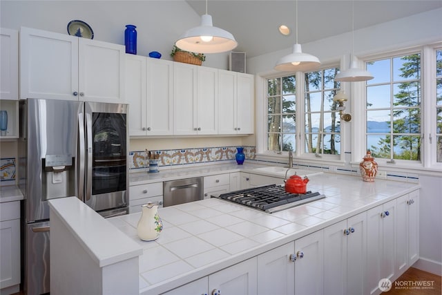 373 Eliza Rd, Lopez Island, WA 98261 - kitchen with appliances with stainless steel finishes, healthy amount of natural light, white cabinetry, pendant lighting, and recessed lighting