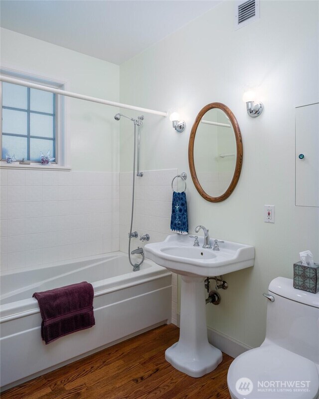 373 Eliza Rd, Lopez Island, WA 98261 - full bath featuring washtub / shower combination and wood finished floors