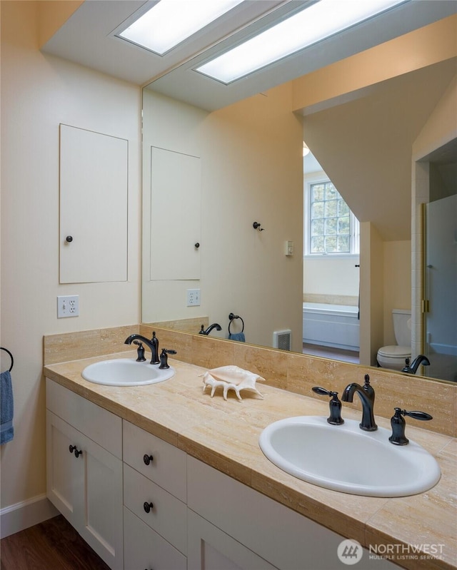 373 Eliza Rd, Lopez Island, WA 98261 - full bathroom featuring double vanity and wood finished floors