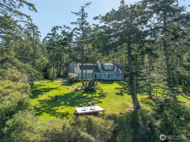 373 Eliza Rd, Lopez Island, WA 98261 - view of grassy yard featuring a wooded view and a wooden deck