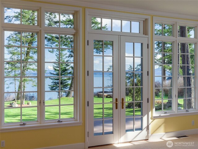 373 Eliza Rd, Lopez Island, WA 98261 - doorway with a water view, french doors, and healthy amount of natural light