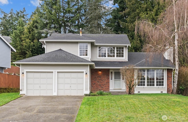 traditional-style house with crawl space, brick siding, an attached garage, and a front yard