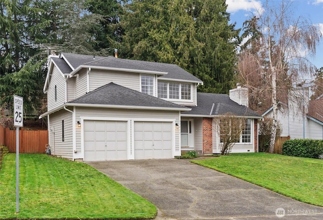 traditional-style home with fence, roof with shingles, a front lawn, concrete driveway, and a garage