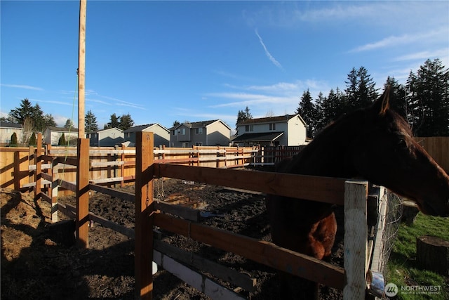 view of yard with a residential view and fence