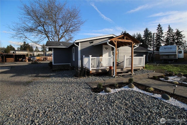 view of front of house featuring a wooden deck