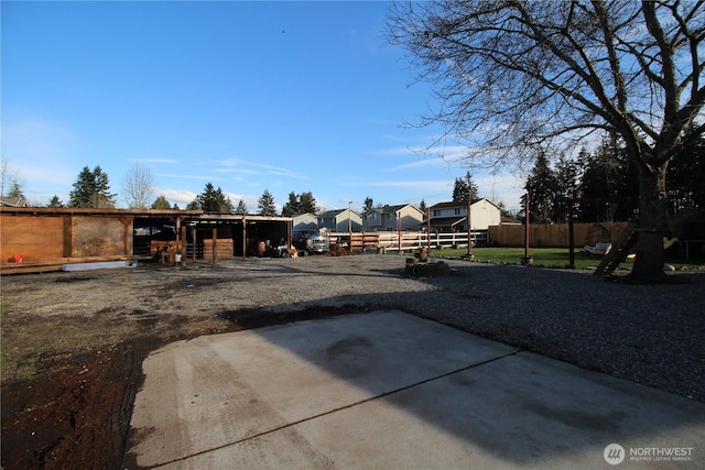 view of yard featuring a patio area and an outdoor structure