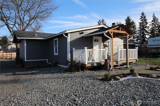 view of front facade with a wooden deck