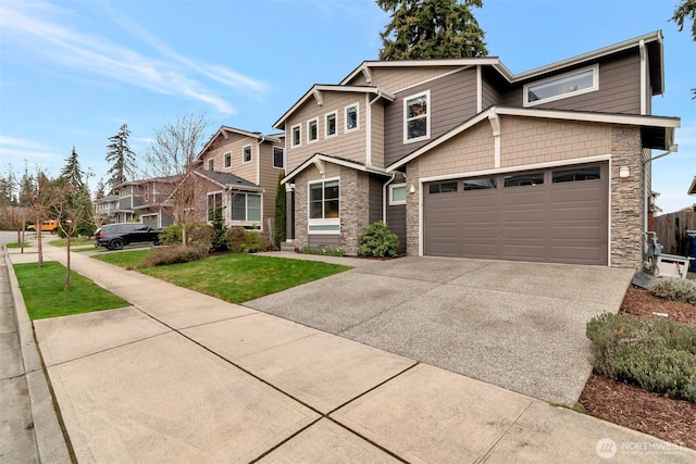 view of front facade with concrete driveway, a residential view, stone siding, and a front yard