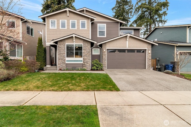 craftsman-style house with stone siding, concrete driveway, and a front lawn