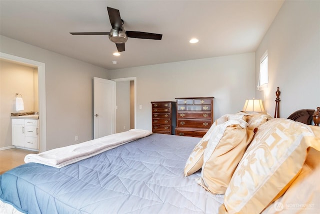 bedroom with recessed lighting, ensuite bath, ceiling fan, and a sink