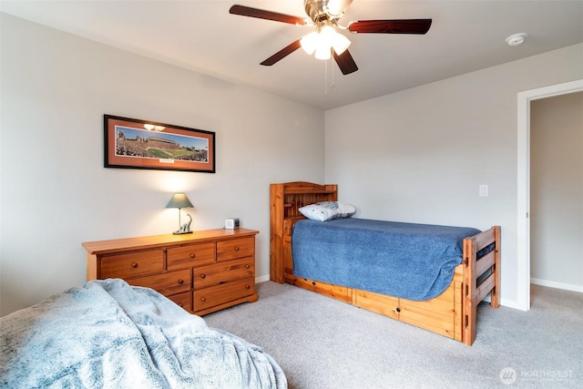 bedroom featuring baseboards, carpet, and a ceiling fan