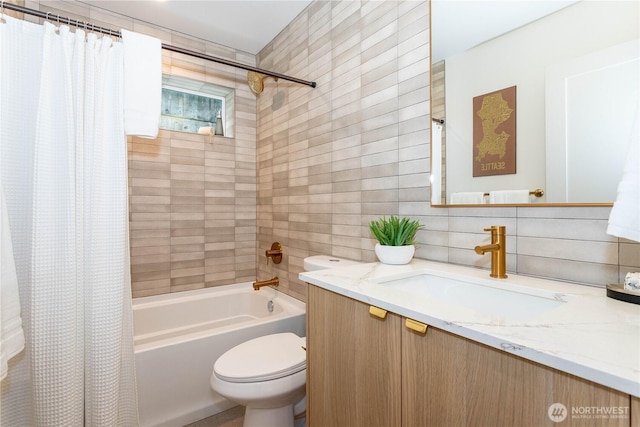 full bath featuring shower / tub combo with curtain, toilet, tile walls, decorative backsplash, and vanity