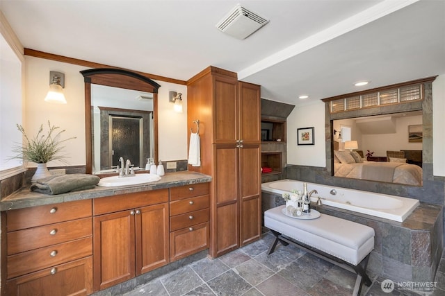 5115 S Willow St, Seattle, WA 98118 - full bath with a bath, vanity, recessed lighting, and stone finish floors