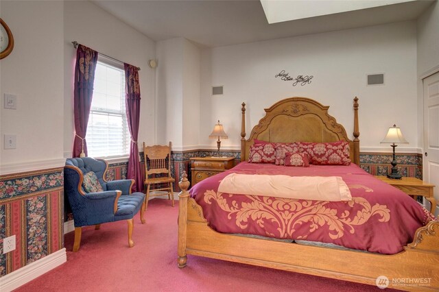 bedroom featuring carpet flooring and visible vents