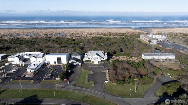 bird's eye view with a water view and a view of the beach