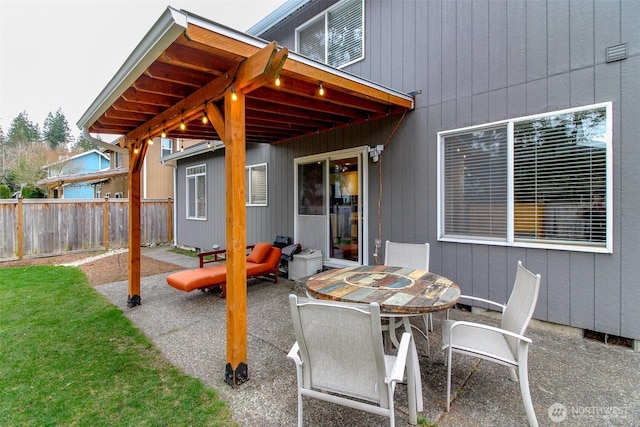 view of patio / terrace with outdoor dining space and fence