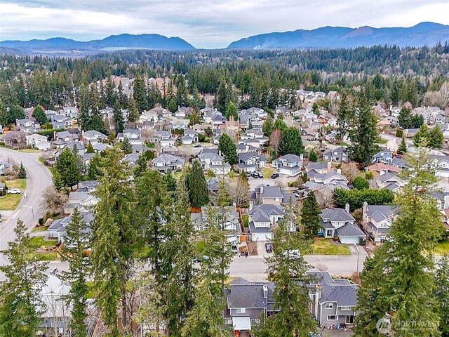 bird's eye view with a residential view and a mountain view