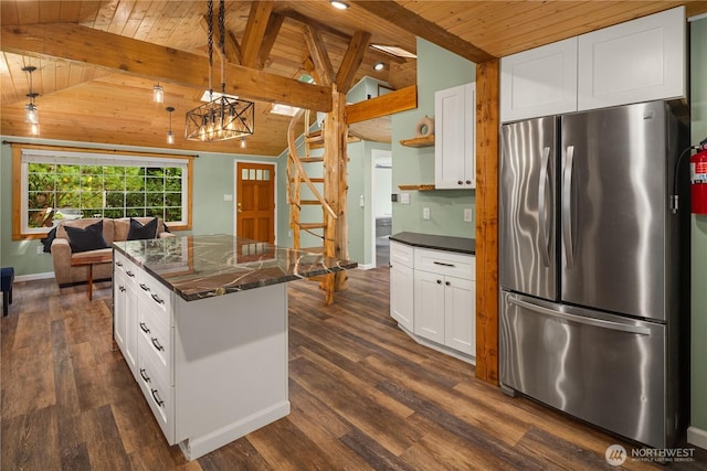 kitchen with vaulted ceiling with beams, wood ceiling, open shelves, and freestanding refrigerator