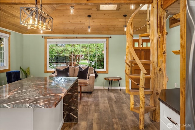 interior space featuring dark wood-style flooring, wood ceiling, baseboards, vaulted ceiling, and stairway