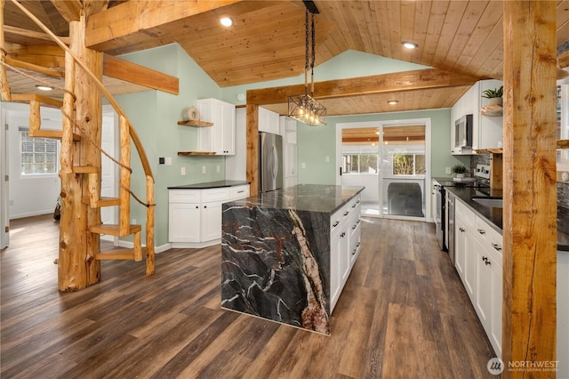 kitchen with vaulted ceiling, appliances with stainless steel finishes, dark countertops, and wood ceiling