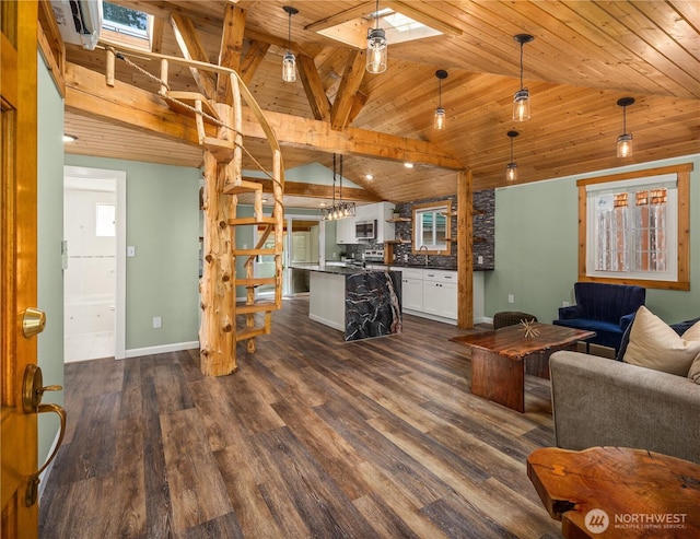 living area featuring dark wood-type flooring, a skylight, wood ceiling, and baseboards