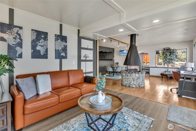 living area with recessed lighting and wood finished floors