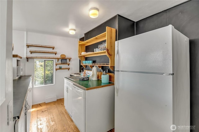 kitchen featuring open shelves, dark countertops, white appliances, white cabinets, and light wood finished floors