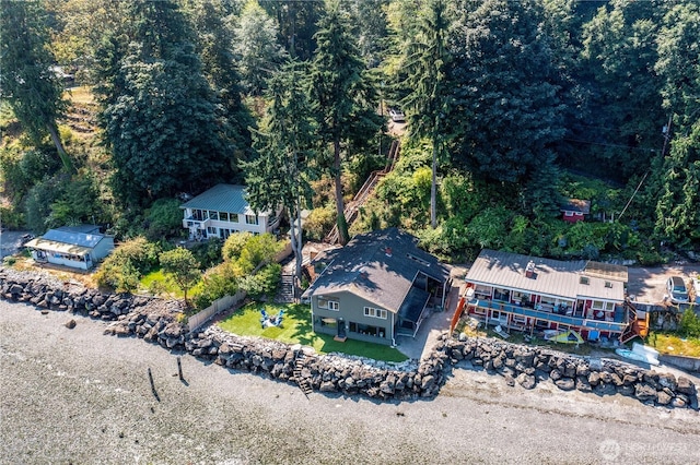 drone / aerial view featuring a view of trees