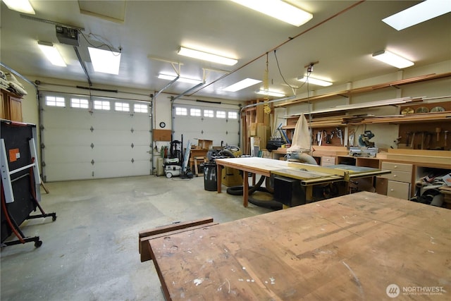 garage featuring a workshop area and a garage door opener