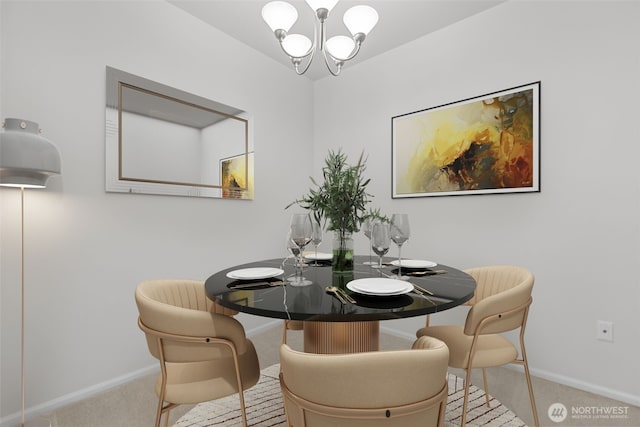 dining room with carpet, baseboards, and a chandelier