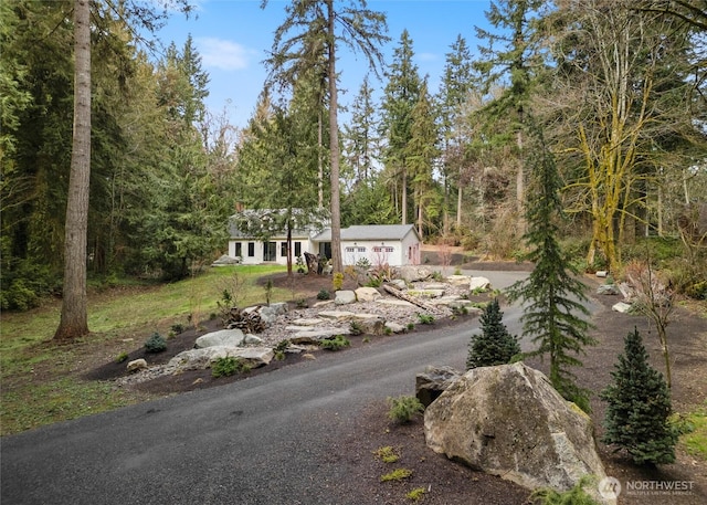 view of street with a forest view