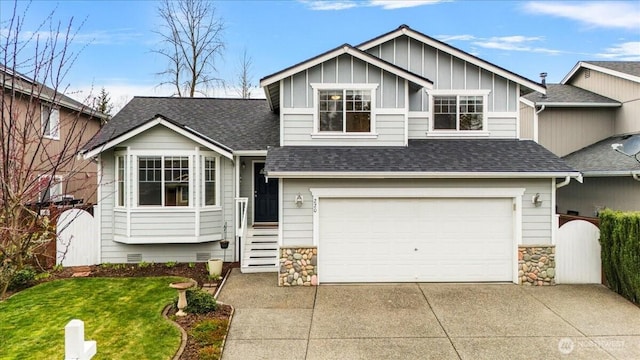 view of front of house with driveway, an attached garage, a shingled roof, crawl space, and board and batten siding