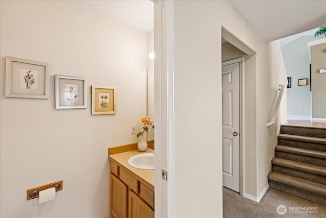 bathroom featuring vanity and baseboards