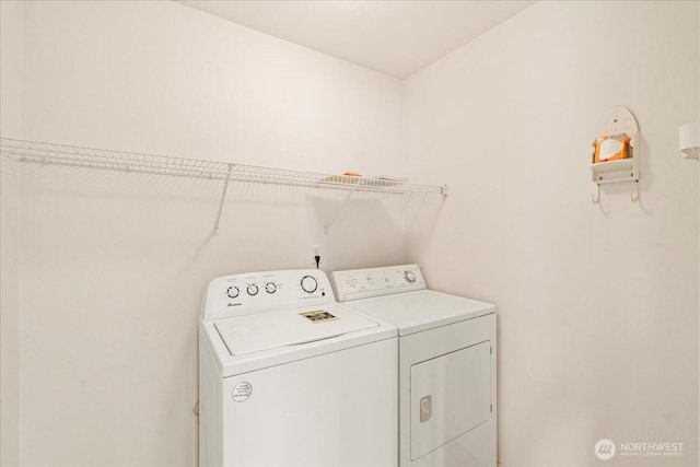 laundry area with washing machine and dryer and laundry area