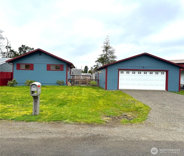 view of side of home with a garage and a yard