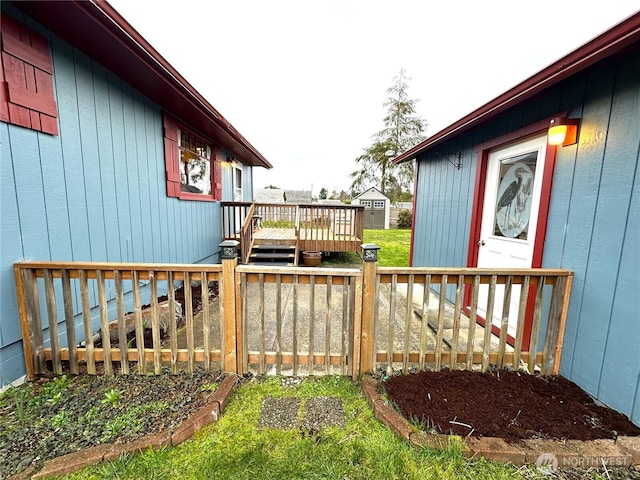 wooden terrace featuring an outdoor structure