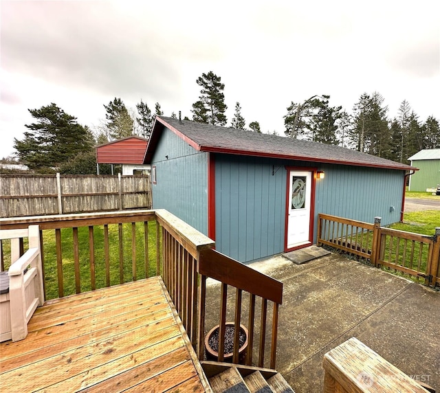 deck with a yard and fence