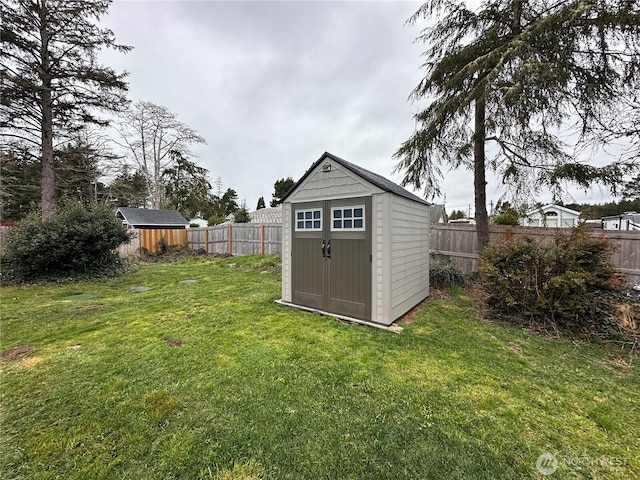 view of shed featuring a fenced backyard