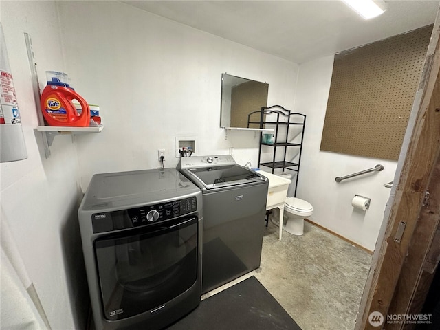 laundry room with independent washer and dryer and laundry area