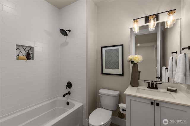 bathroom featuring tub / shower combination, vanity, and toilet