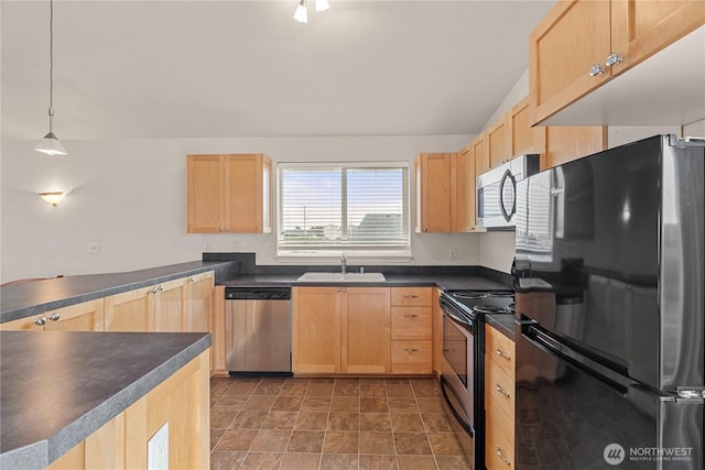 kitchen featuring a sink, light brown cabinets, and stainless steel appliances