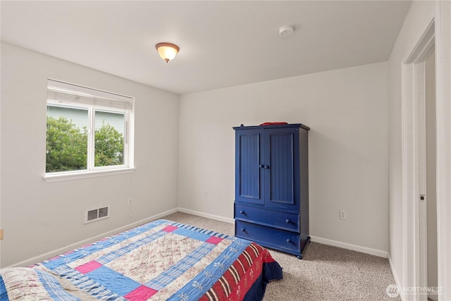 bedroom featuring visible vents, light colored carpet, and baseboards