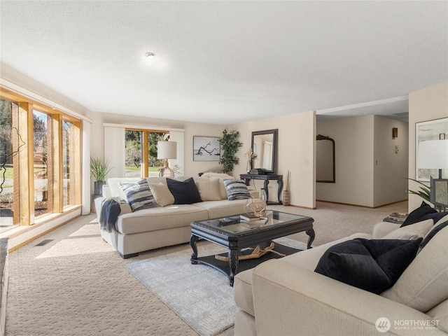 living room featuring visible vents and light carpet