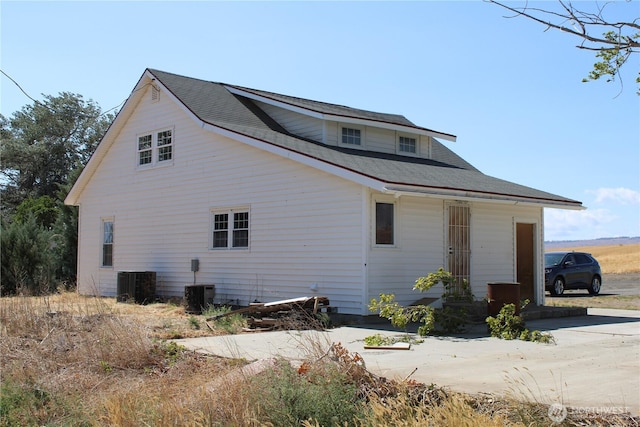 view of side of property with cooling unit